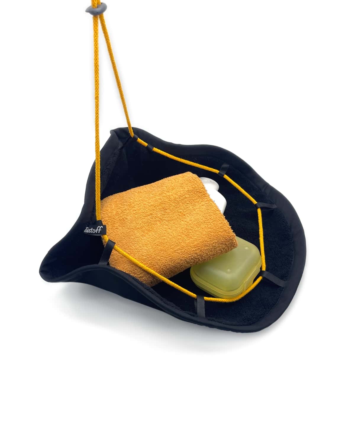 Soap, towel and shampoo in the shower bag